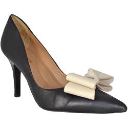Black leather pump with cream colored bow on the toe